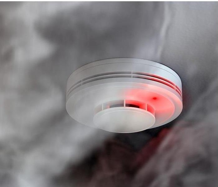 smoke and soot surrounding fire detector