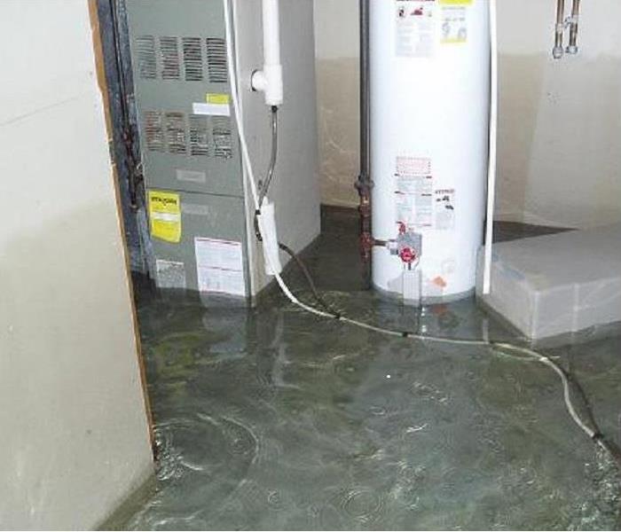 A flooded basement with water ankle deep after a storm