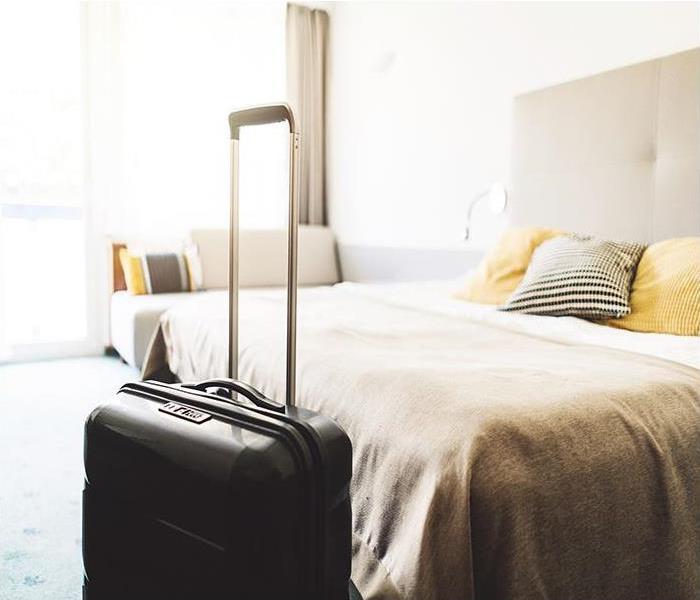 Beautiful modern hotel room and suitcase