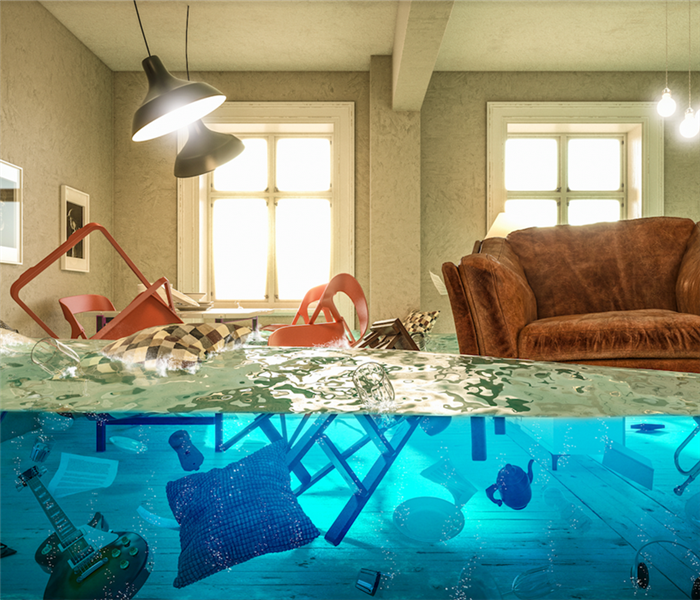 a flooded living room with water floating everywhere